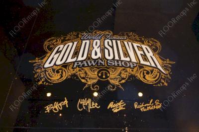 Gold and Silver Pawn Shop Logo with Pawn Star cast signatures completed using white and grey epoxies with gold flake on a black epoxy coated floor using our 3.4 mil vinyl stencils.