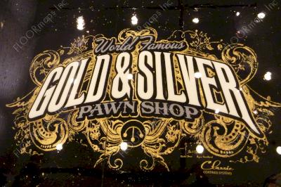 Gold and Silver Pawn Shop Logo completed using white and grey epoxies with gold flake on a black epoxy coated floor using our 3.4 mil vinyl stencils.