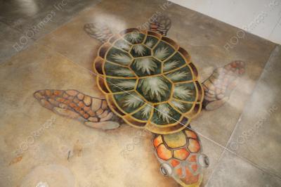 Orange, green backed Australian sea turtle installed on a polished concrete floor using dye and 3.4 mil vinyl finished with sealer.