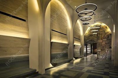 Dynamic view of the Hotel Indigo hallway showing full view of geometric floor pattern.