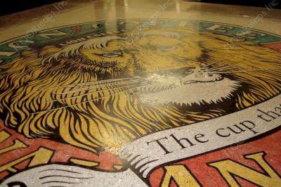 Close up of complete Lion Coffee logo installed with Ameripolish Classic concrete dye colors.