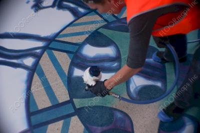 In progress of installing the 2nd layer of the 17 ft turtle with Ameripolish turquoise concrete dye.