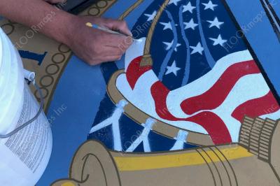 Close up of US Army Seal on light gold microtopping circle and blue, yellow, black, red, gold, and white spray paint installed with 3.4 mil vinyl stencil and Deco Guard sealer